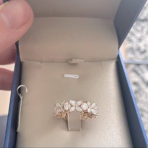 Victoria designs moissanite and yellow gold eternity band